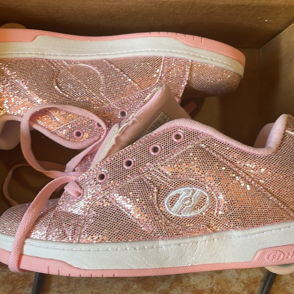 Pink sparkly Heelys women’s size 9 .unpackaged, but never used